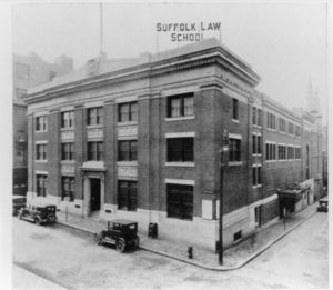 Exterior of Suffolk University's Archer Building (20 Derne Street) that shows Suffolk Law School sign on roof