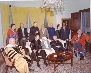 Monan, J. Donald at Harvard commencement receiving honorary degree with Mother Theresa, President Derek Bok, and Tennessee Williams