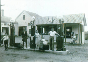 Dorilla (Robichaud) Peloquin with her husband, children and mother at the snack stand and station