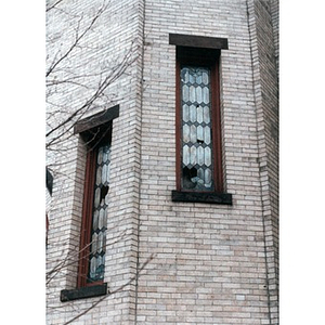 Broken stained glass windows in the All Saints Lutheran Church.