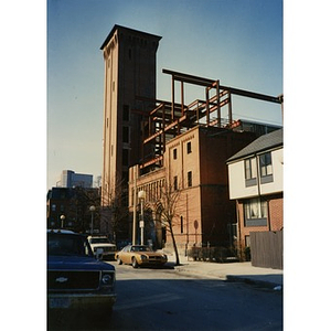 Steel beam framing used in the construction of Taino Tower is visible here above the shell of the former Shawmut Congregational Church.