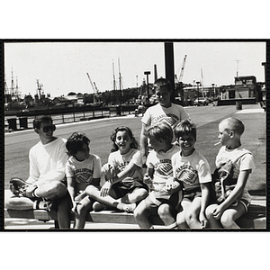 A Group of children sitting on the pier at the Charlestown Navy Yard