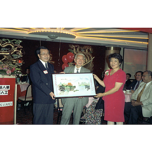 Guests and painting at the Chinese Progressive Association's 20th Anniversary and the Workers' Center's 10th Anniversary celebration