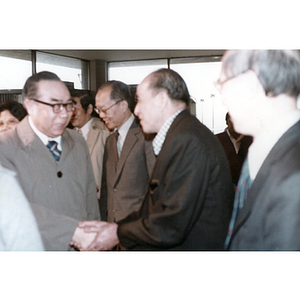 You King Yee shakes the hand of Chinese Ambassador Chai Zemin as he arrives in Boston