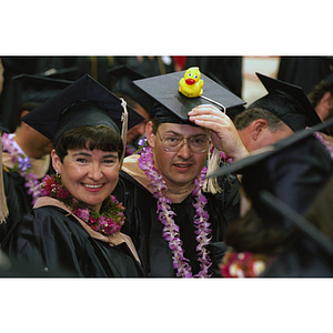 Graduates wearing leis at commencement