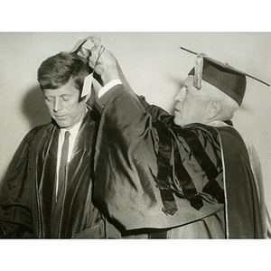 President Ell, right, hooding Senator John F. Kennedy