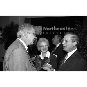 Neal Finnegan and Eugene Reppucci converse at the Sheehan Seminar Room dedication reception