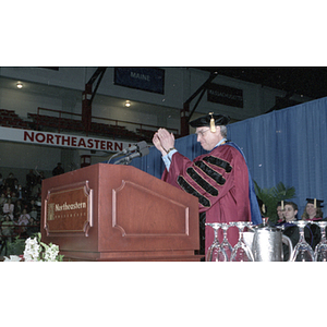 President Freeland applauding the School of Law graduates