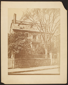 Exterior view of the Hancock House with Elizabeth Lowell Hancock (Moriarty) Wood (standing left)