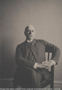 Charles F. Adams, Jr., seated, facing camera