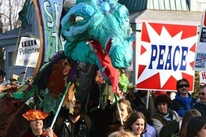 Anti-war marchers, dragon puppet, and 'Peace' signs: rally and march against the Iraq War