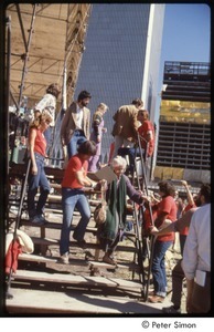 MUSE concert and rally: Maggie Kuhn being helped down the stage stairs