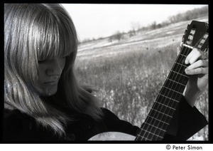 Karen Helberg: close-up, playing acoustic guitar