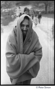 Man standing in the road, wrapped tightly in a blanket, Rowe Center spiritual retreat