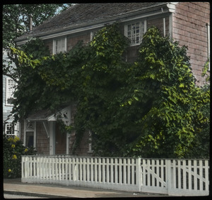 Nantucket (two story house with white picket fence)