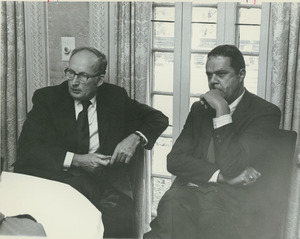 Randolph W. Bromery sitting indoors with President Robert C. Wood