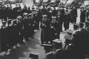 Faculty and dignitaries in commencement procession into Curry Hicks Cage