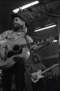 New Riders of the Purple Sage opening for the Grateful Dead at Sargent Gym, Boston University: John 'Marmaduke' Dawson playing acoustic guitar with David Nelson in background