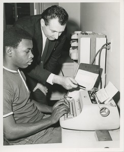 An instructor and trainee at TOWER clerical training