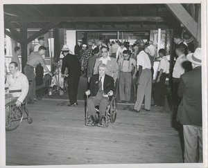 Wheelchair user disembarking from boat