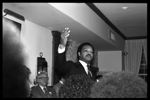 Jesse Jackson at the podium, addressing supporters