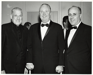Cardinal Richard Cushing, Mayor John F. Collins, and Boston Celtics Coach Arnold "Red" Auerbach at a black-tie event
