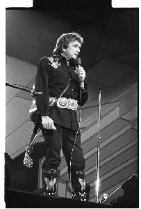 Johnny Cash, American country star. Singing in Kings Hall, Belfast, includes shots taken with his wife, June Carter