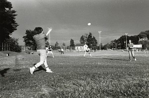 Students playing baseball at Shea Field
