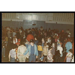 Children in Halloween costumes congregate at a Halloween party