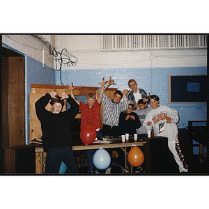 A Group of boys pose for a photo at an open house