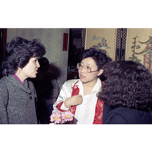 Suzanne Lee chats with two women at the end of a gathering held by the Chinese Progressive Association to celebrate the Chinese New Year