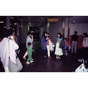 People socializing at a voter registration event