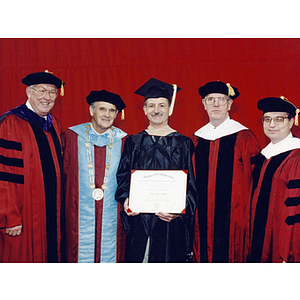Officials and graduate from the 1996 commencement