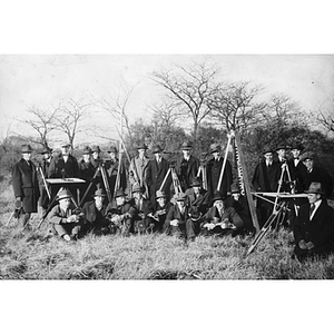 Group of Civil Engineering students in Back Bay Fens with surveying equipment