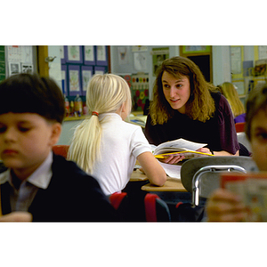 A co-op student reading to a child