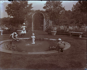 Children playing by the garden pool of the Saltonstall House, Milton, Mass.