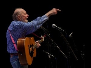 Pete Seeger on stage on his guitar at the Power of Song Award concert, Symphony Space, New York City