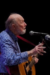 Pete Seeger on stage on his guitar at the Power of Song Award concert, Symphony Space, New York City