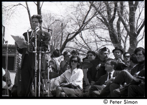 Resistance on the Boston Common: Staughton Lynd addressing the crowd with Terry Cannon (far right) and Noam Chomsky (2d from right) seated on stage