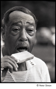 Duke Ellington eating a popsicle at Jackie Robinson's jazz concert