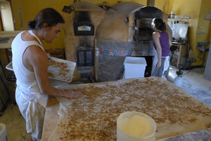 Hungry Ghost Bread: owner and baker Jonathan C. Stevens working on cinnamon rolls