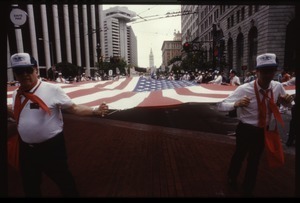 Veterans carrying a large American flag in the San Francisco Pride Parade