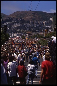 Massive crowd with pride flags marching in the San Francisco Pride Parade