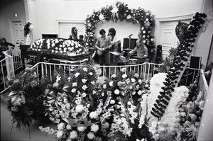 Duane Allman's funeral: musicians setting up with Duane Allman's casket in foreground, from left: Barry Oakley, Jaimoe, Delaney Bramlett, Dickey Betts, Butch Trucks, and Thom Doucette