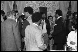 Jesse Jackson working the crowd, talking with Bill Strickland