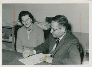 Dr. Seth Arsenian signing a document