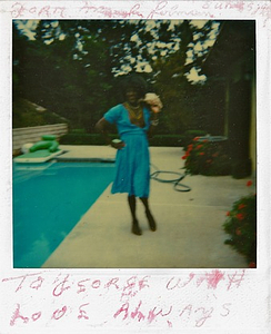 A Photograph of Marsha P. Johnson Posing Poolside in a Blue Dress