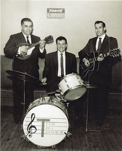 The Tri-Tones posing with instruments