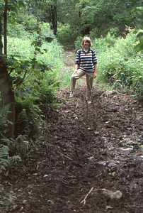 Katherine Whybrow, Williams Class of 1989, stands in wheel rut on the Taconic Crest Trail.
