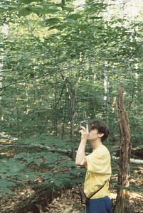 Jonah C. Wittkamper, Class of 1997, measuring tree height of sample tree in Permanent Plot 1121 with a Haga Altimeter.
